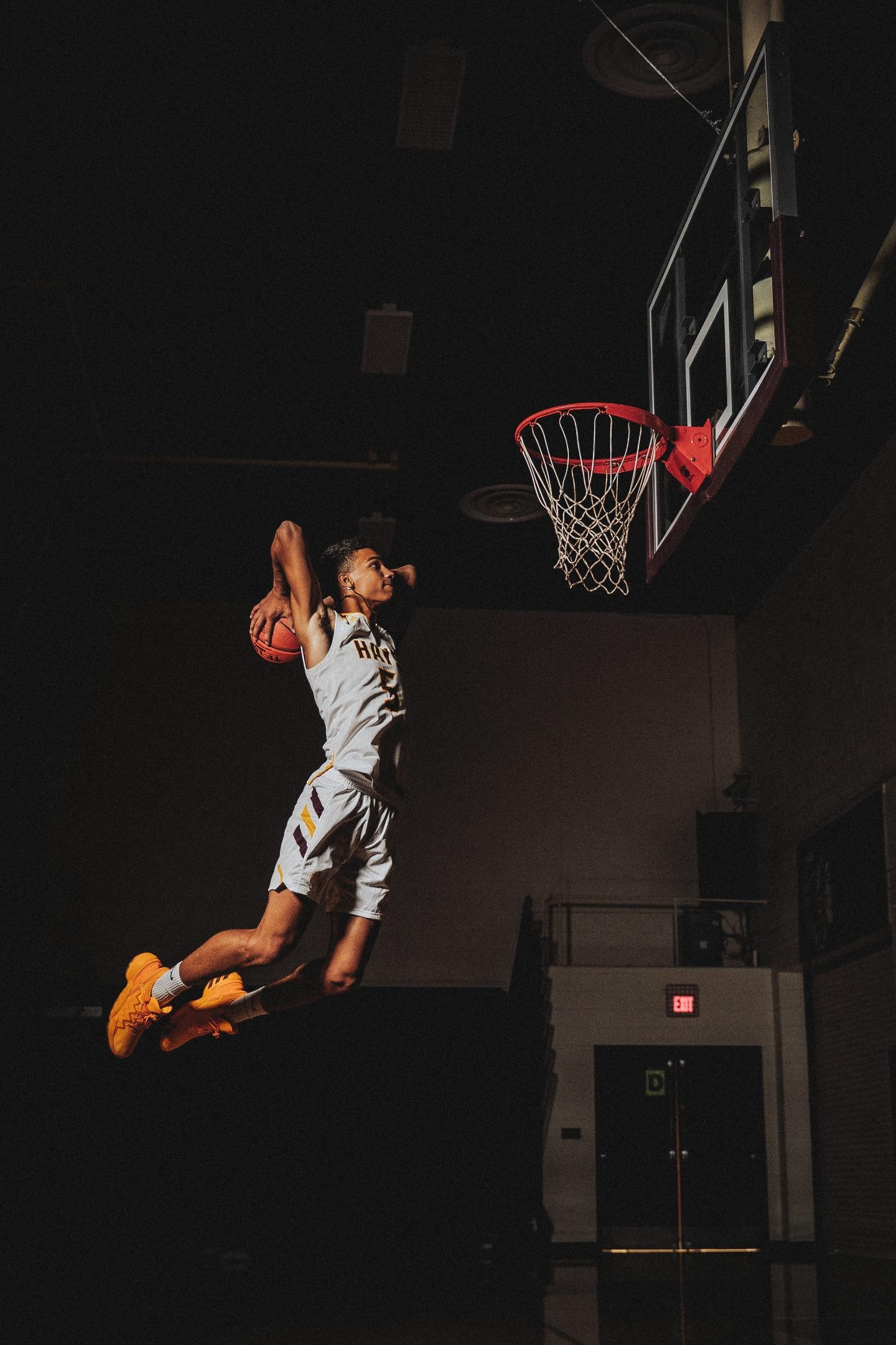 basketball player jumping for a slam dunk